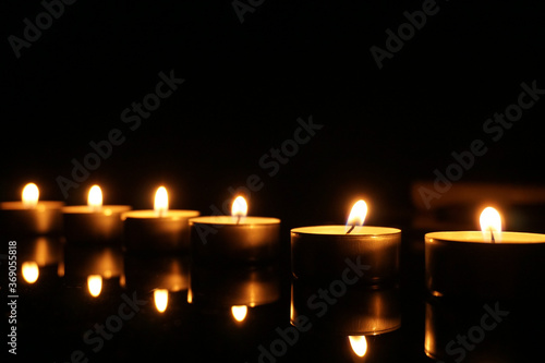 Candles on a glass desk