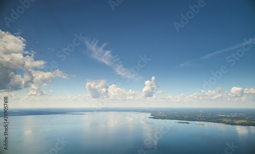Blue color lake with cloudscape © PixieMe