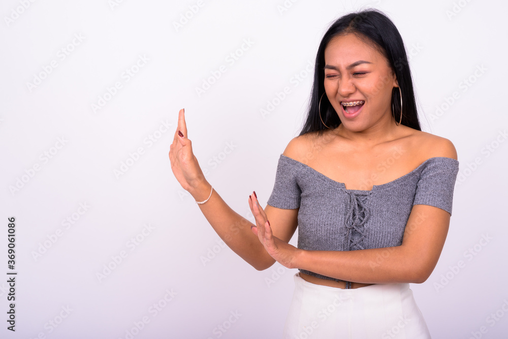 Portrait of happy young beautiful Asian woman with braces Portrait of happy young beautiful Asian woman with braces