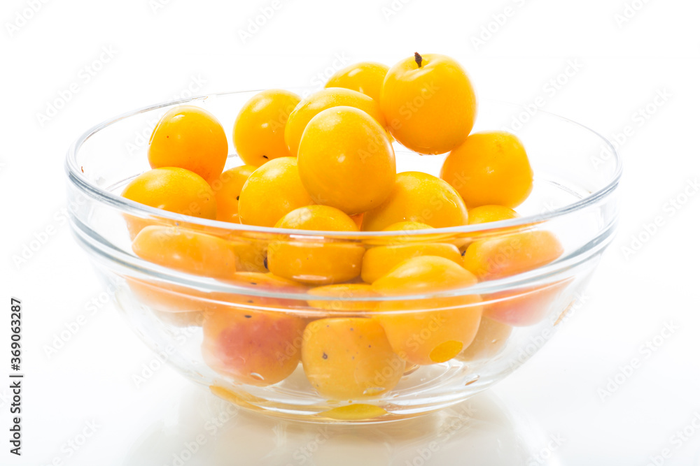 yellow cherry plums on the white background yellow cherry plums on the white background