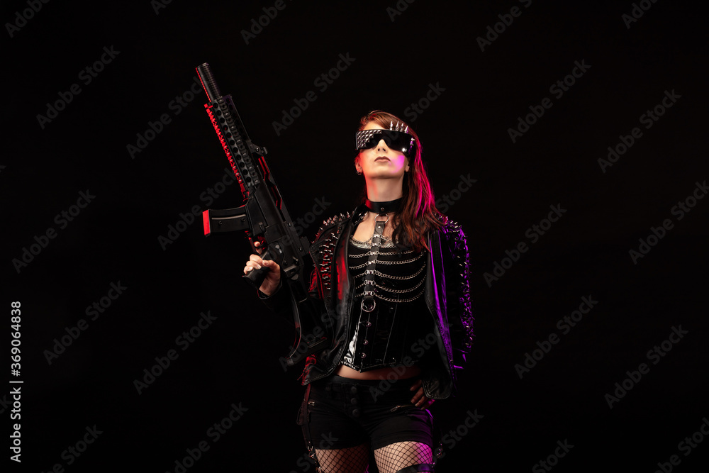 Young woman dressed in a studded leather jacket, a pair of cyberpunk glasses, holding an assault rifle in her hands Young woman dressed in a studded leather jacket, a pair of cyberpunk glasses, holding an assault rifle in her hands