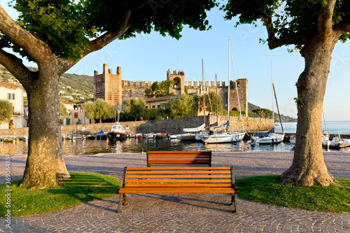 The lakeside of Torri del Benaco with the marina and the Scaliger castle. Lake Garda, Verona province, Veneto, Italy, Europe.