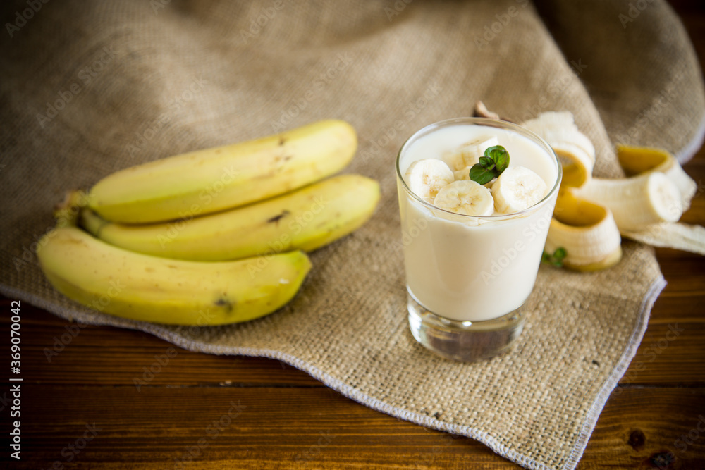 tasty homemade yogurt with bananas in a glass on a wooden table tasty homemade yogurt with bananas in a glass on a wooden table