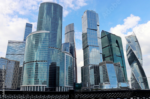 View to skyscrapers of Moscow city from the embankment of the Moscow river. Futuristic city in summer, concept of urbanization, russian economy