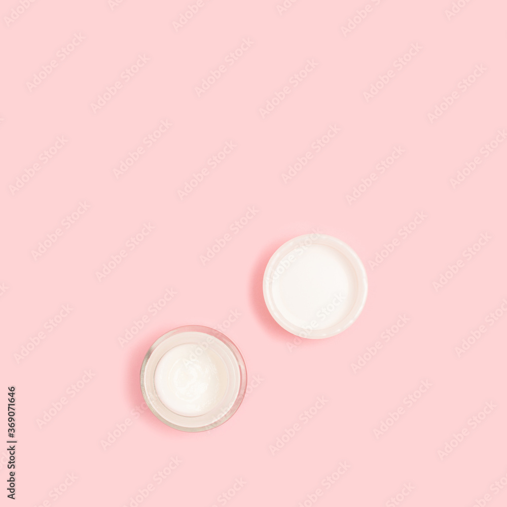 Face cream on a pink pastel background. Beauty products layout with copy space. Face cream on a pink pastel background. Beauty products layout with copy space.