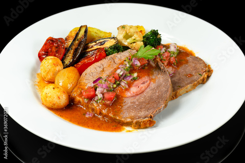 delicious dish with stuffed meat and grilled vegetables