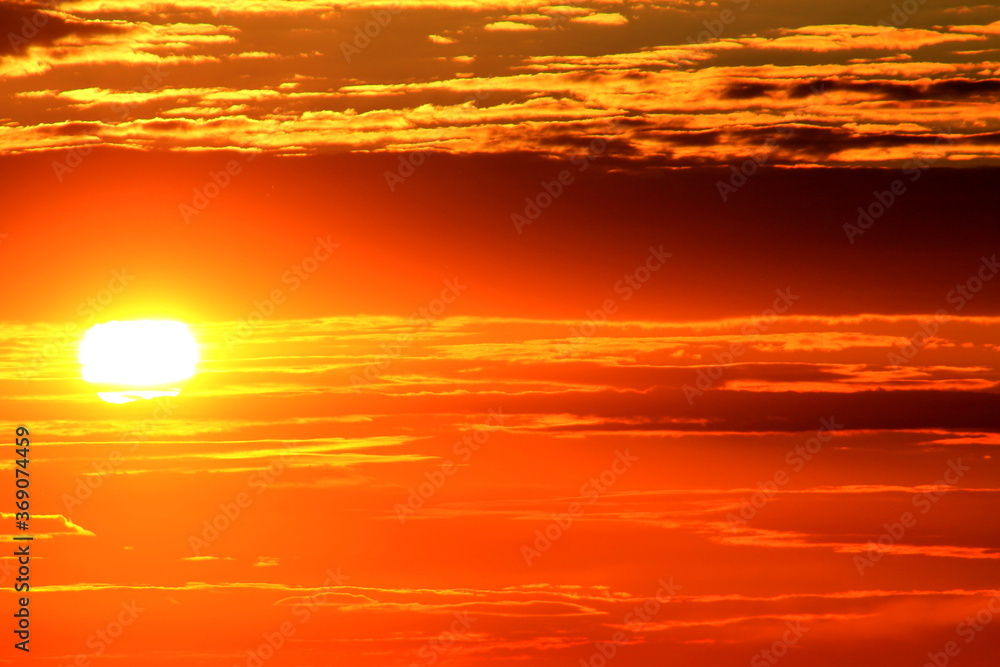orange sun in the sky at sunset