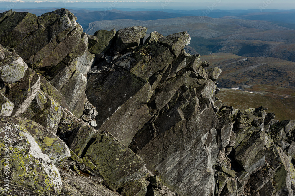 Large boulders of rock, in a national park in the Polar Urals, Russia. Hiking concept.