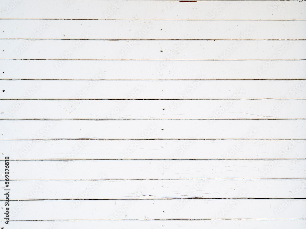 Old white wooden planks background. Texture of old boards with peeling paint Old white wooden planks background. Texture of old boards with peeling paint