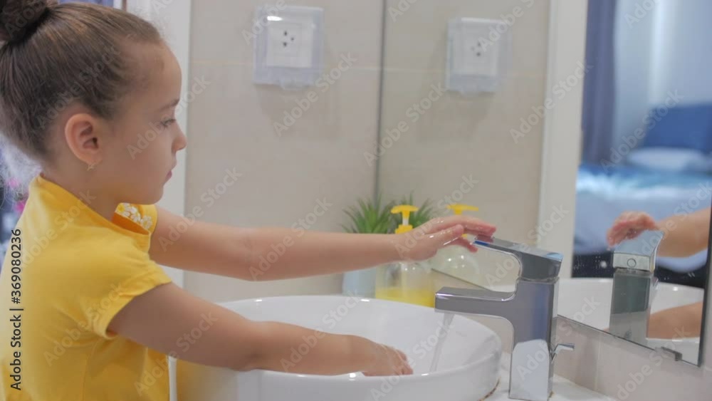 Concept Handwashing. Little girl or child washes hands with soap, hands washing to prevention diffusion of virus and bacteria. Personal hygiene or Prevention coronavirus covid 19 Concept Handwashing. Little girl or child washes hands with soap, hands washing to prevention diffusion of virus and bacteria. Personal hygiene or Prevention coronavirus covid 19