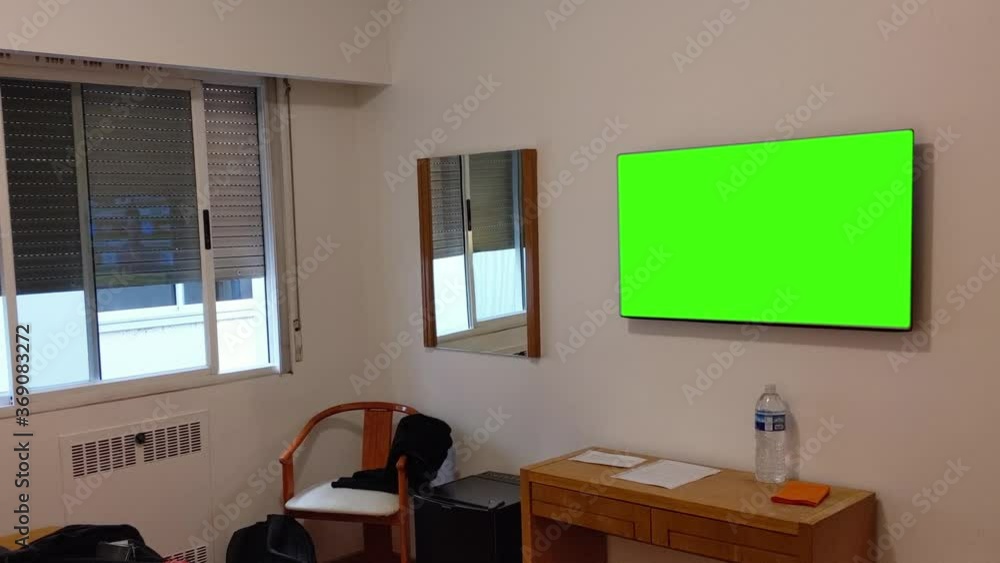 Green Screen Television in a Room. You can replace green screen with the footage or picture you