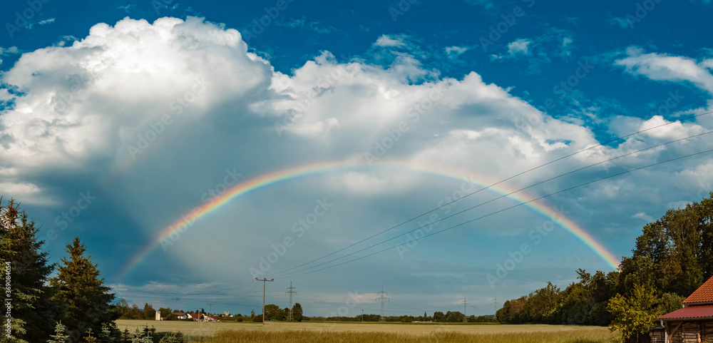 High resolution stitched panorama of a beautiful rainbow near Tabertshausen, Bavaria, Germany High resolution stitched panorama of a beautiful rainbow near Tabertshausen, Bavaria, Germany