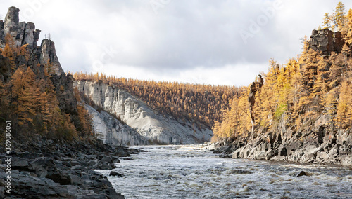 Landscape with the Siberian river in a rocky gorge in autumn. photo