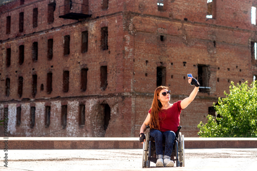 A girl with disabilities at the historical monument.