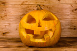Spooky halloween pumpkin on a wooden table