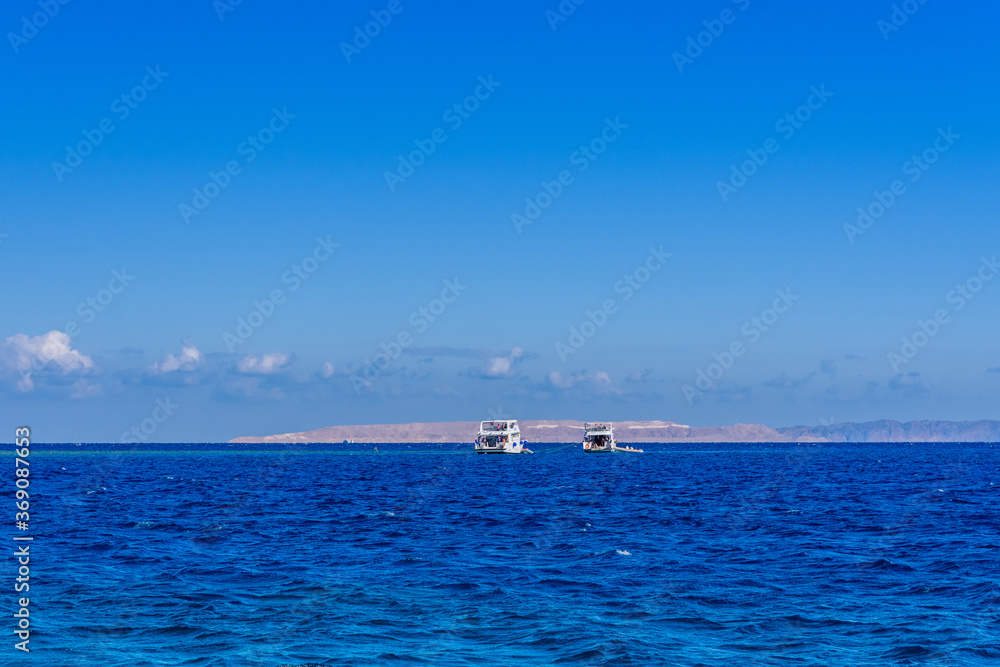 White yachts in Red sea not far from the Hurghada city, Egypt