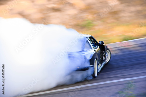 Car race. High-speed track. Smoke