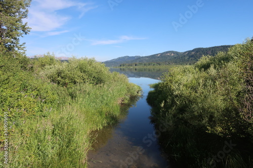 Narrow creek going in to a lake