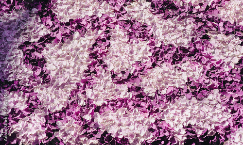 Purple and pink paper flowers in the form of texture close-up. Handmade background, copy space.