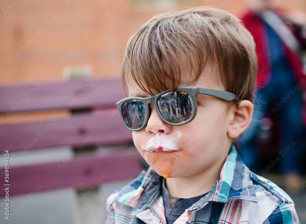 little boy makes a mess eating ice cream cone little boy makes a mess eating ice cream cone