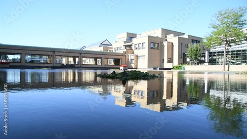 Reflection the pond of the hall way at the left and entrance of the Museon, the Hague municipality museum, Netherlands