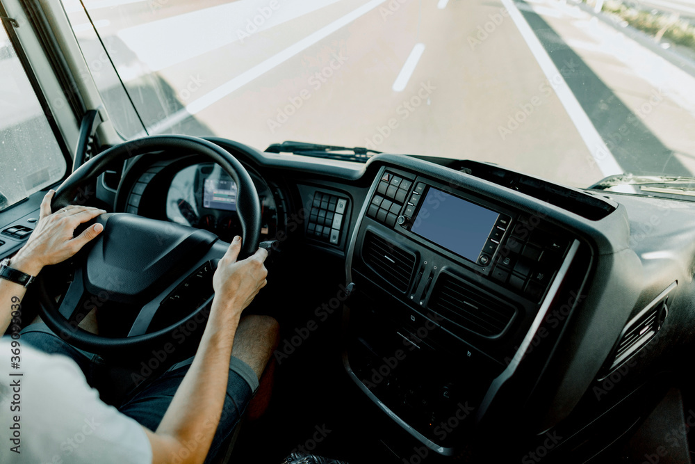Scene of a truck driver driving on the road. Scene of a truck driver driving on the road.