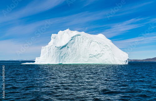Climate Change. Iceberg afrom glacier in arctic nature landscape on Greenland. Icebergs in Ilulissat icefjord. famously affected by global warming.