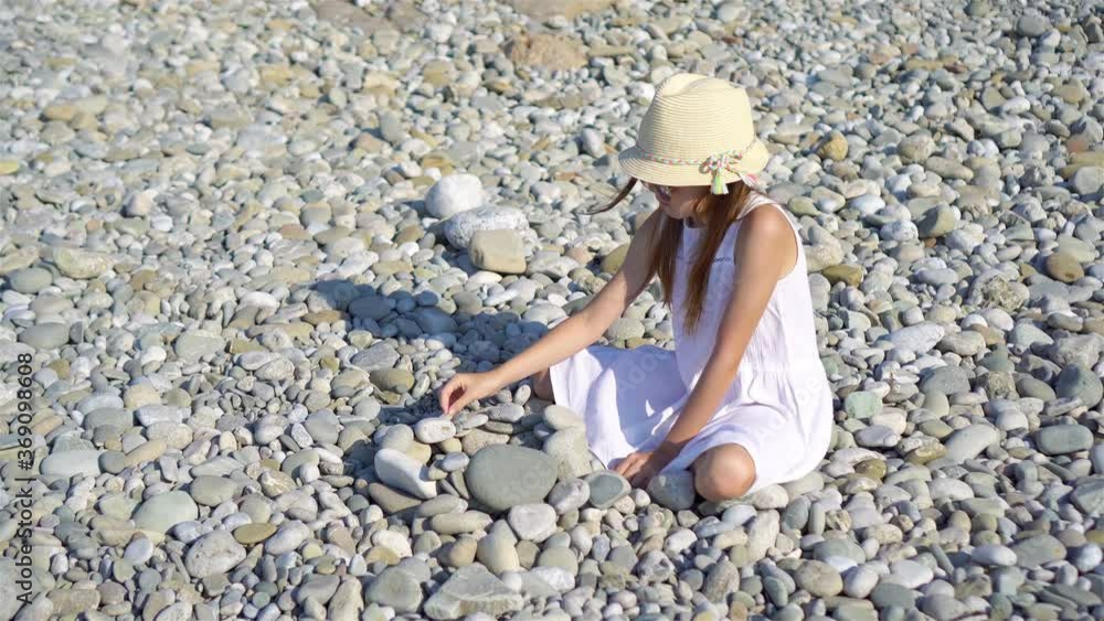Cute little girl at beach during summer vacation Cute little girl at beach during summer vacation