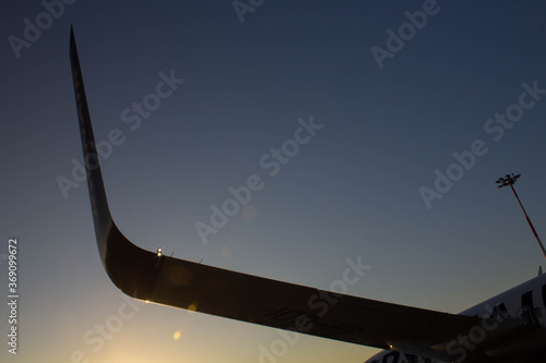 2020.02.20 Palermo Punta Raisi, Ryanair low cost airline in flight in Italy evocative image
of the plane's wing in backlight at sunset