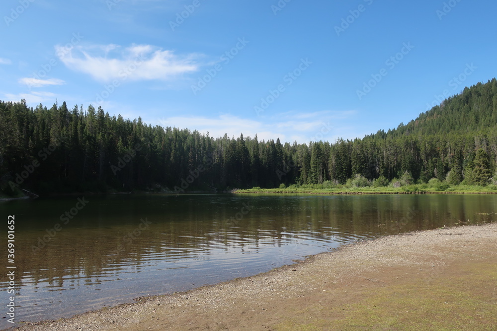 Reflecting water in a small lake in the Tetons, Wyoming