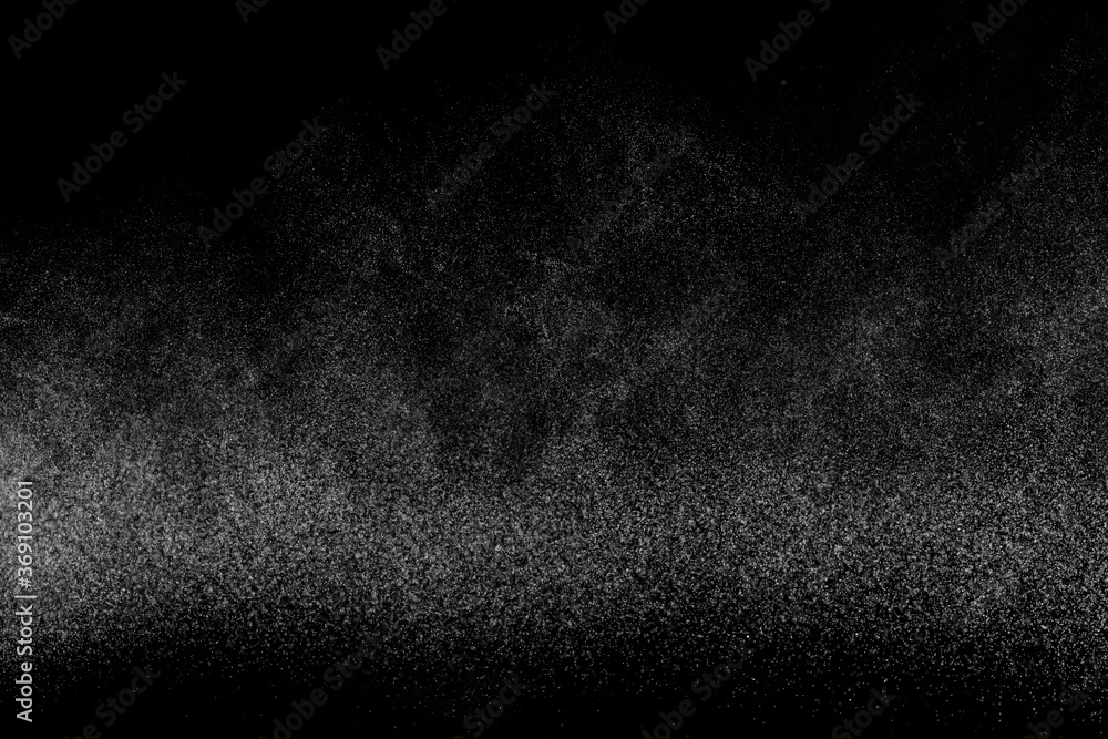 Abstract splashes of water on black background. Freeze motion of white particles. Rain, snow overlay texture. Abstract splashes of water on black background. Freeze motion of white particles. Rain, snow overlay texture.