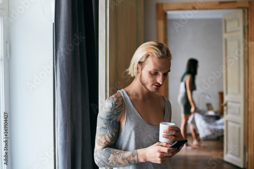 Man Checking E-mail On Smartphone photo