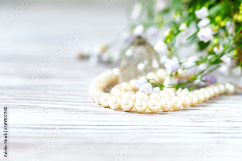 Beautiful white pearl necklace with white flowers.