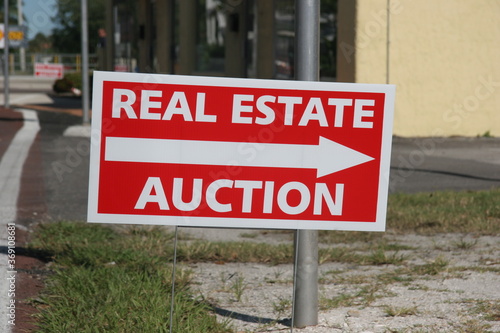Real Estate Auction Sign. Economic Downturn during Layoffs and Pandemic lead to people losing there homes because they cannot pay the mortgage to the bank.