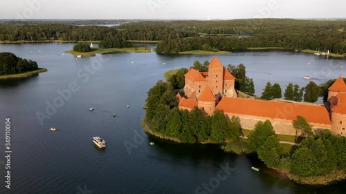 360 Hyperlapse of Trakai Island castle in Lithuania. Trakai island castle is lokated in Galve lake, Lithuania. Aerial hyperlapse of castle and plenty of ships, boats and other water transportation. photo
