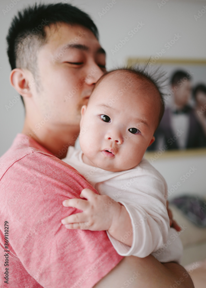 portrait of father with baby at home portrait of father with baby at home