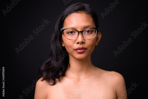 Portrait of young beautiful Asian woman shirtless