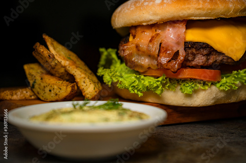 Tasty burger on rustic background © alexander