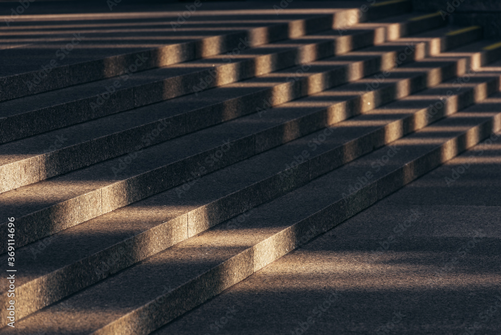 Sunlight on gray stone stairs