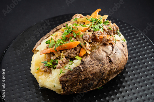 baked potato on the black background