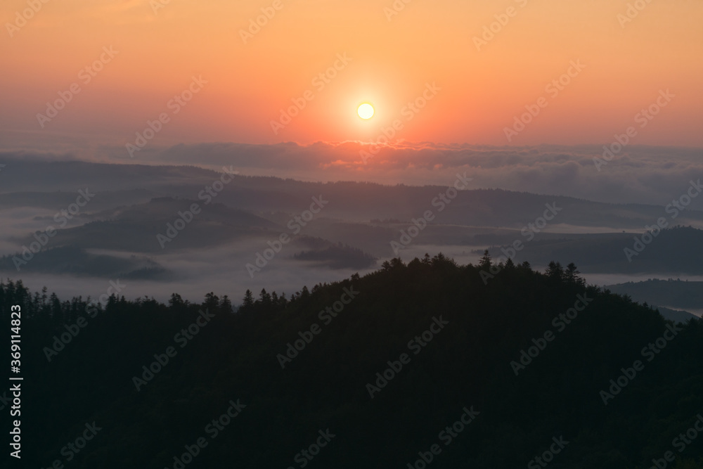 fiery dawn with fog in the mountains fiery dawn with fog in the mountains