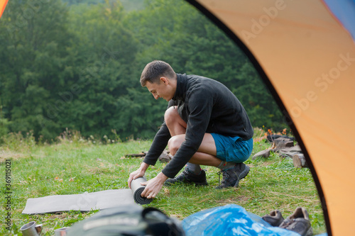 photo from the tent of a guy collecting karemat photo