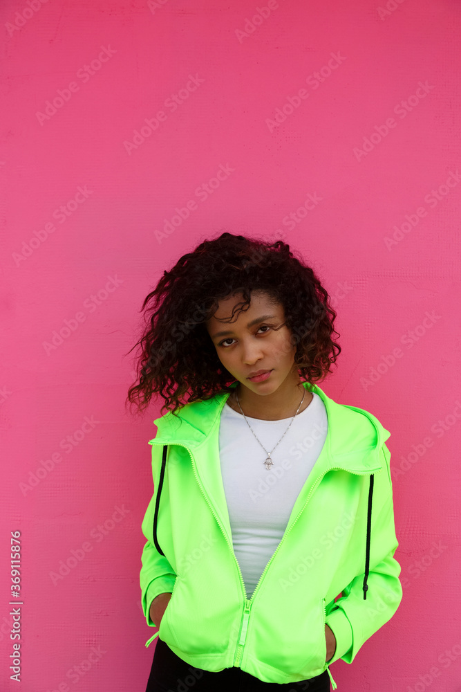 Thoughtful stylish black woman standing on street Thoughtful stylish black woman standing on street