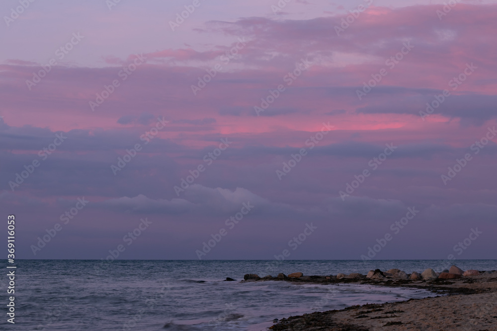 seascape with cloudy and pastel colored sky