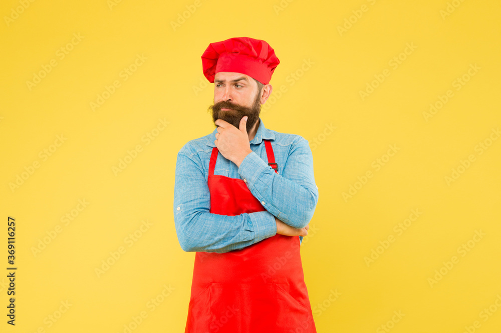 Professional chef man think about recipe. excellent cook or baker. special offer from chef. chef in restaurant kitchen. mature male chef on yellow backdrop. man cooking on kitchen Professional chef man think about recipe. excellent cook or baker. special offer from chef. chef in restaurant kitchen. mature male chef on yellow backdrop. man cooking on kitchen