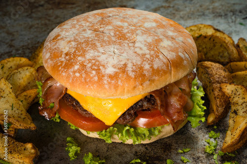 Tasty burger on rustic background