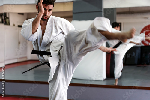 Man Practicing Karate In The Studio.