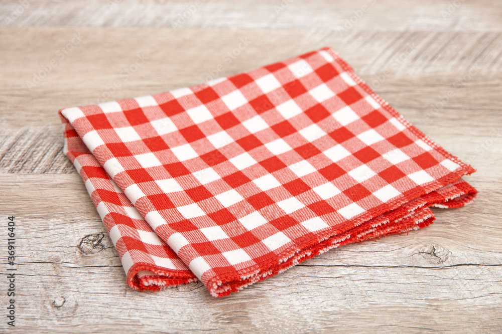 Red tablecloth on wooden table Red tablecloth on wooden table
