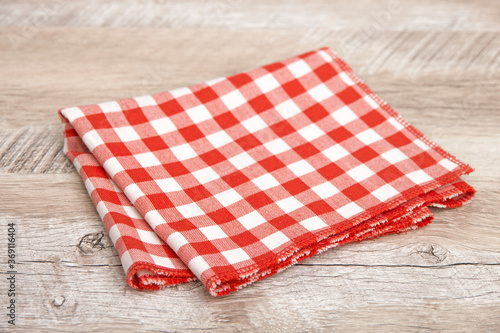 Red tablecloth on wooden table