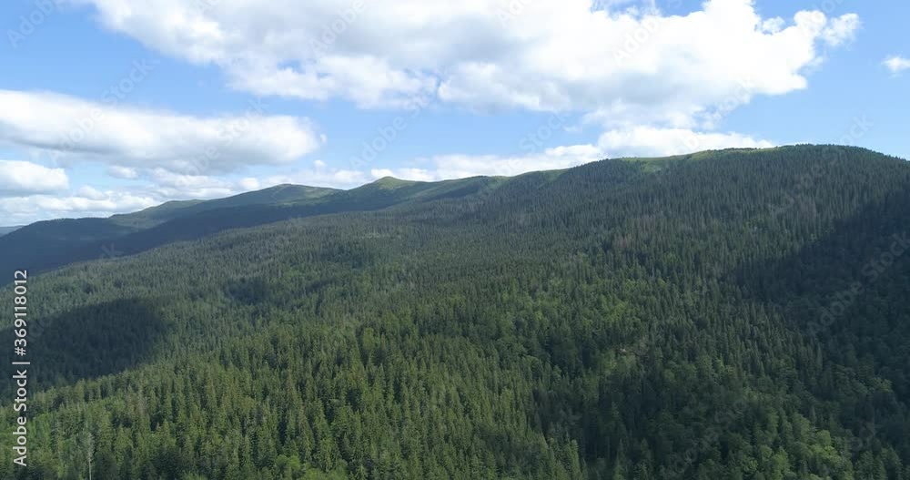 Drone flight over mountains covered with coniferous forest. Drone flight over mountains covered with coniferous forest.